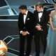 BB-8, Oscar Isaac, Mark Hamill, and Kelly Marie Tran onstage at the 90th Annual Academy Awards. Or...a dramatic interpretation of Academy voters looking at one of those popular films. Who can say?